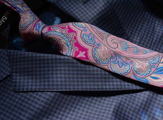 suit and colorful tie